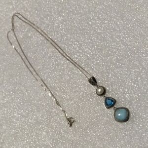 This is a MarahLago Azure Larimar necklace featuring a cushion-cut larimar stone